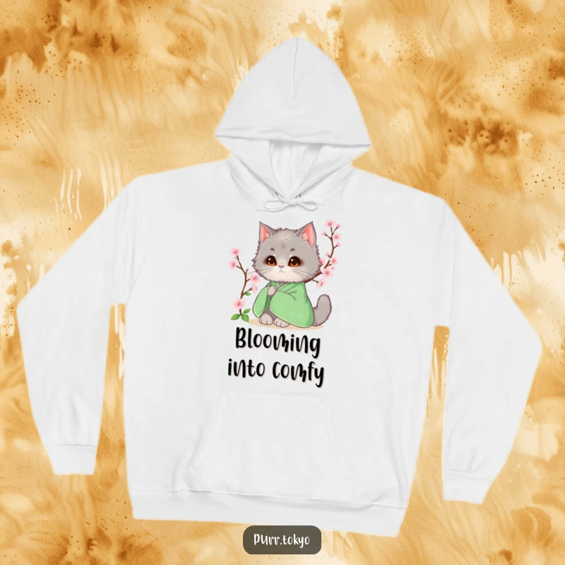 Funny hoodie featuring a fluffy grey cat in a green kimono resting by a blooming cherry blossom, embodying peace.